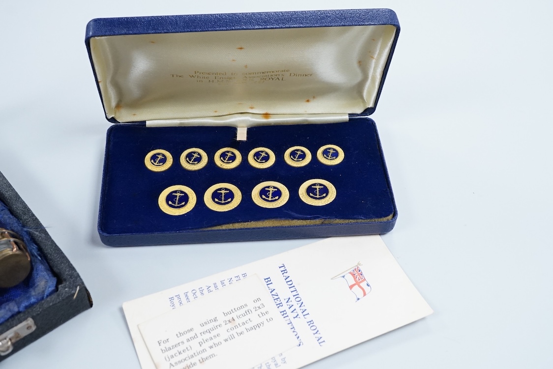 A cased set of enamelled naval buttons and similar keyrings